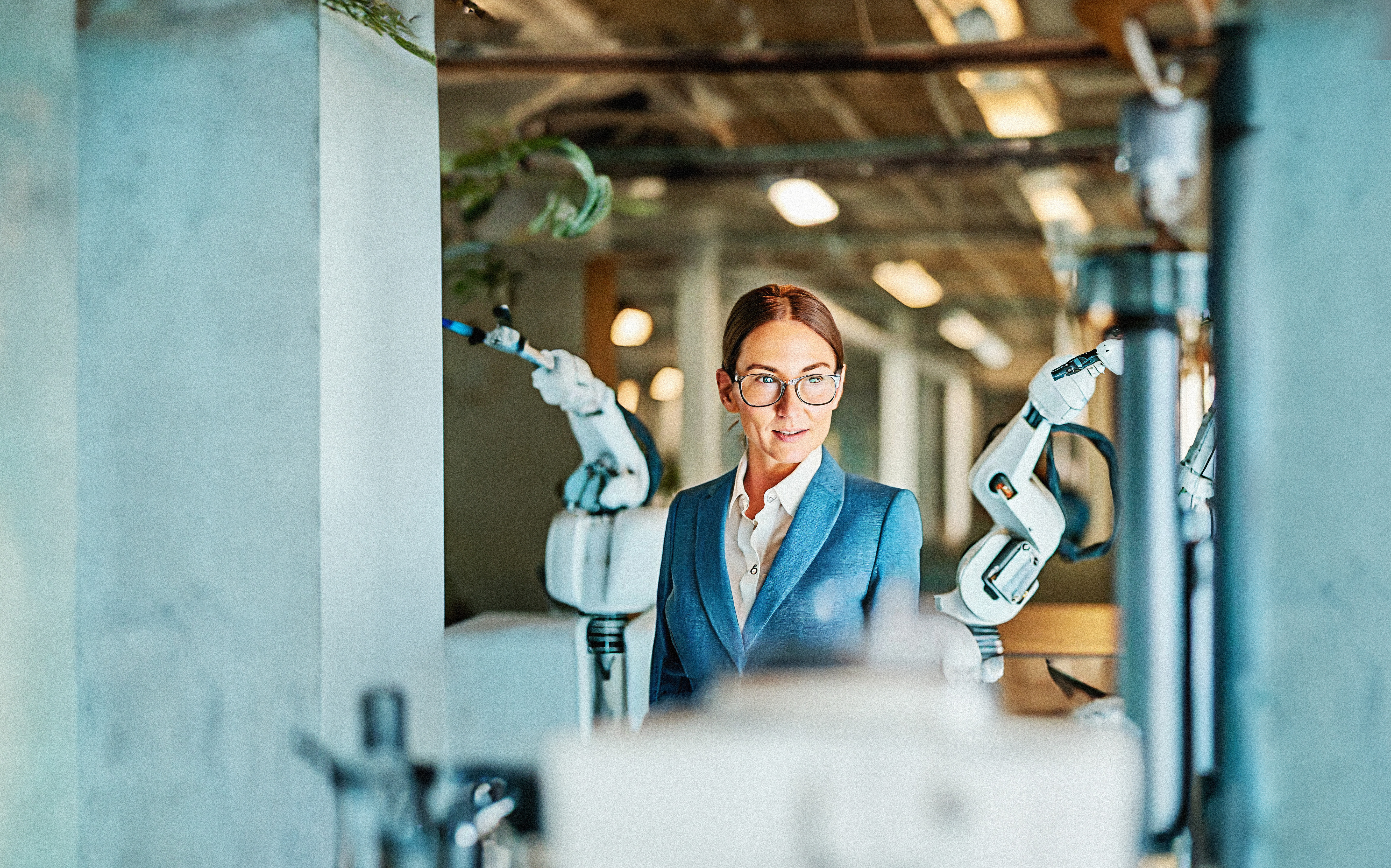 Man with laptop at a production line