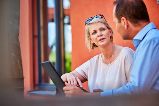 Kristina Galari talks to a colleague outside.