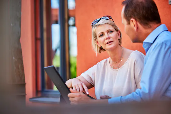 Kristina Galari talks to a colleague outside.