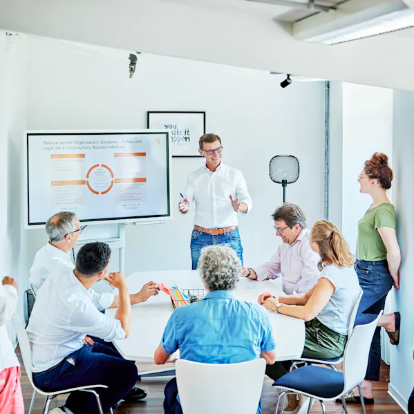 Andreas Jackel gives a presentation to his colleagues.